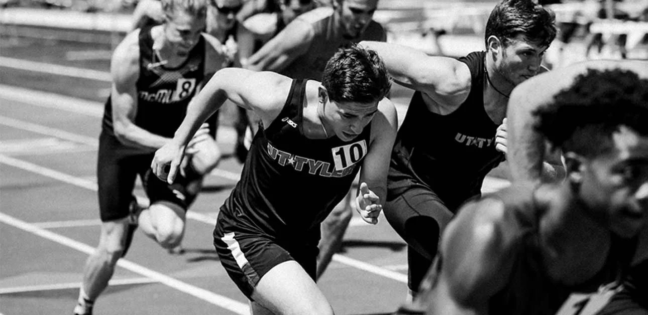 athletes running on the track field